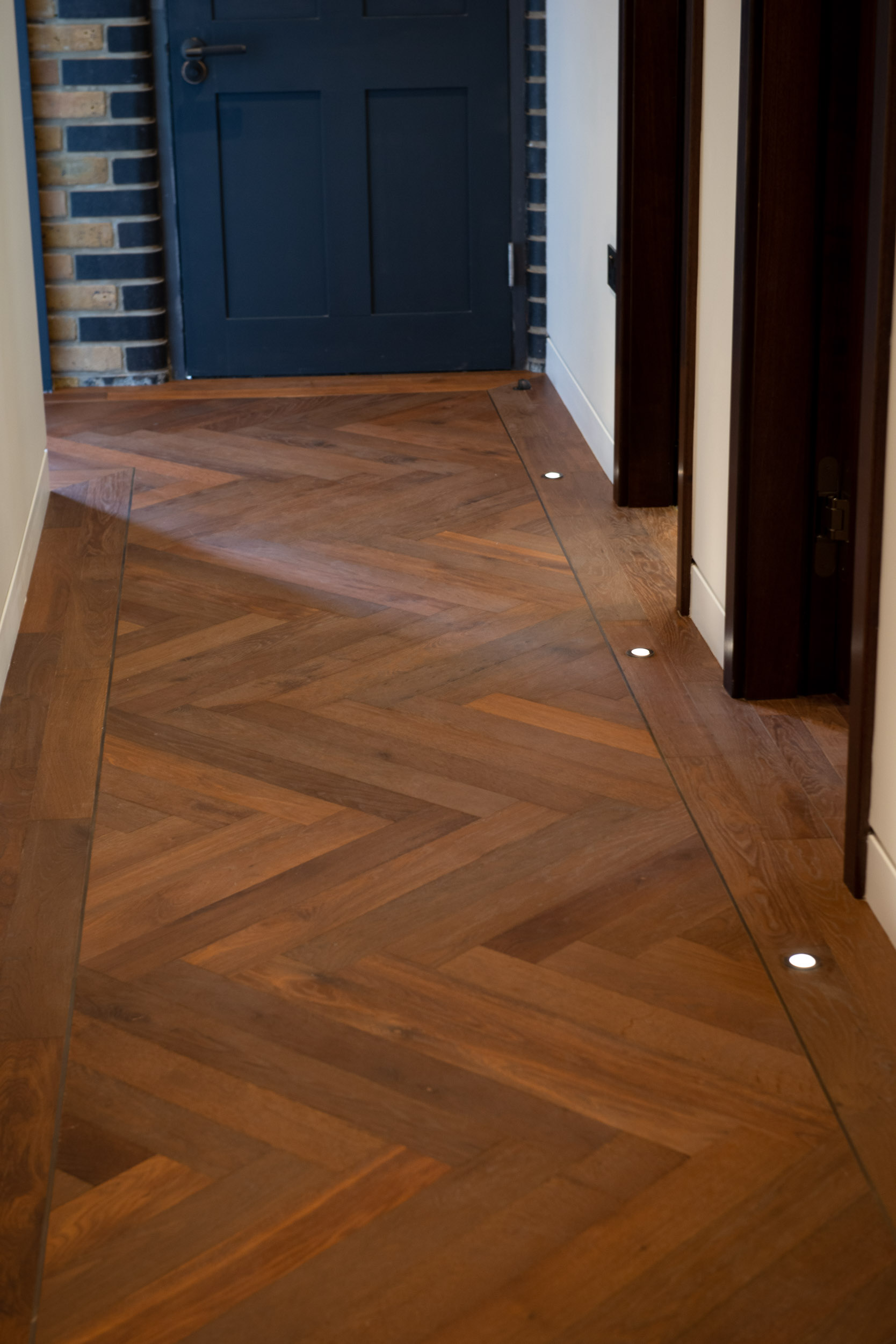Medium Thermo Oiled Herringbone Parquet Wood Flooring in hallway